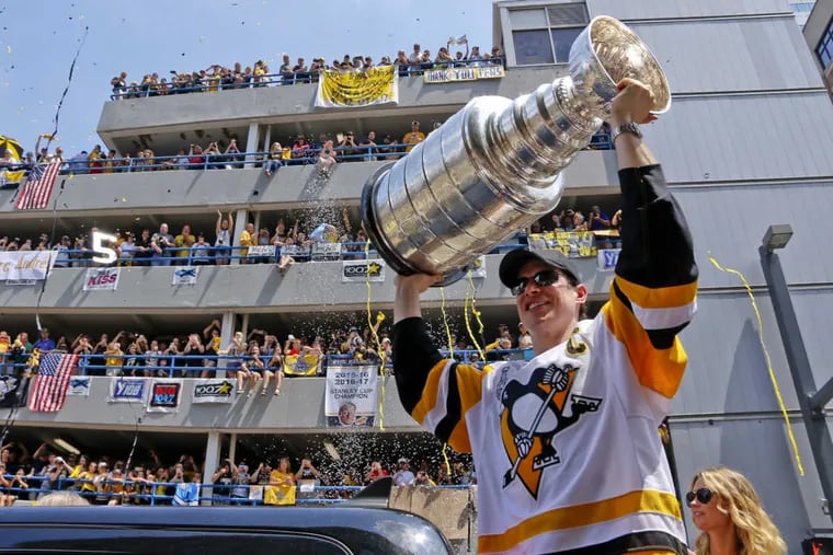 Penguins superstar Sidney Crosby hoisted the Stanley Cup during a victory parade in June. The Penguins, who had threatened to leave the Steel City at one time, have won five of Pittsburgh’s 13 championships since 1968.
