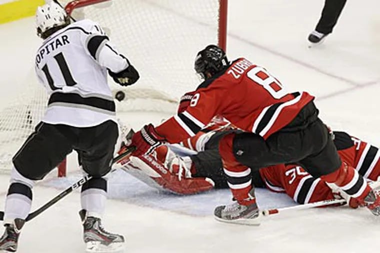 The Devils and Kings both said they were off their game in the Stanley Cup opener. (Kathy Willens/AP)