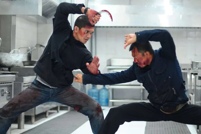 Iko Uwais and Cecep Arif Rahman in "Raid: Redemption," the sequel to the ultra-violent "The Raid." Netflix wants to remake "The Raid" and set it in Philadelphia's Kensington neighborhood.