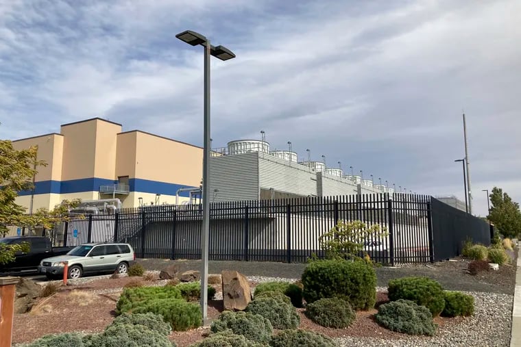 In this Tuesday, Oct. 5, 2021, photo, shows the exterior of a Google data center in The Dalles, Oregon. (AP Photo/Andrew Selsky)