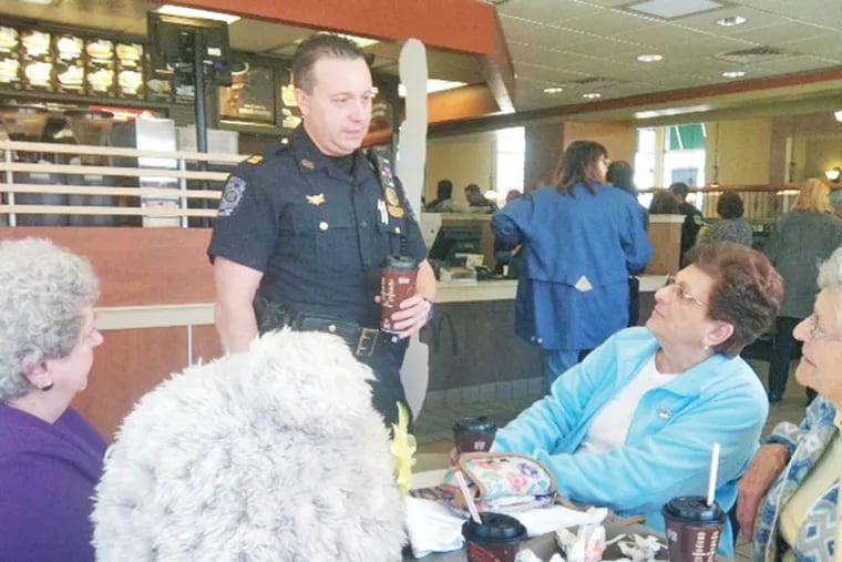 Capt. Anthony Paparo, center, talks with a group of woman who attended the department’s first Coffee with a Cop at McDonald’s in Upper Darby. Clockwise, from left to right are Lucille Mancellotti, Betty Pisch, Joyce McHugh and Frances Randazzo.