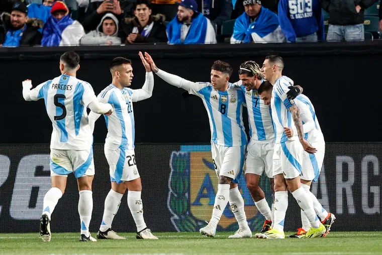 Enzo Fernández (center) celebrates after scoring Argentina's second goal.