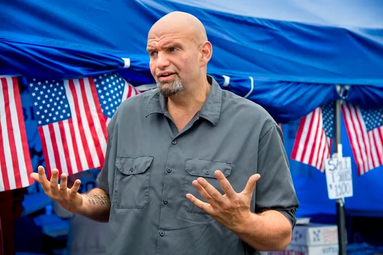 Braddock Mayor and Democratic candidate for Lieutenant Governor John Fetterman talks to fairgoers as he campaigns at the 163rd Bloomsburg Fair September 25, 2018.