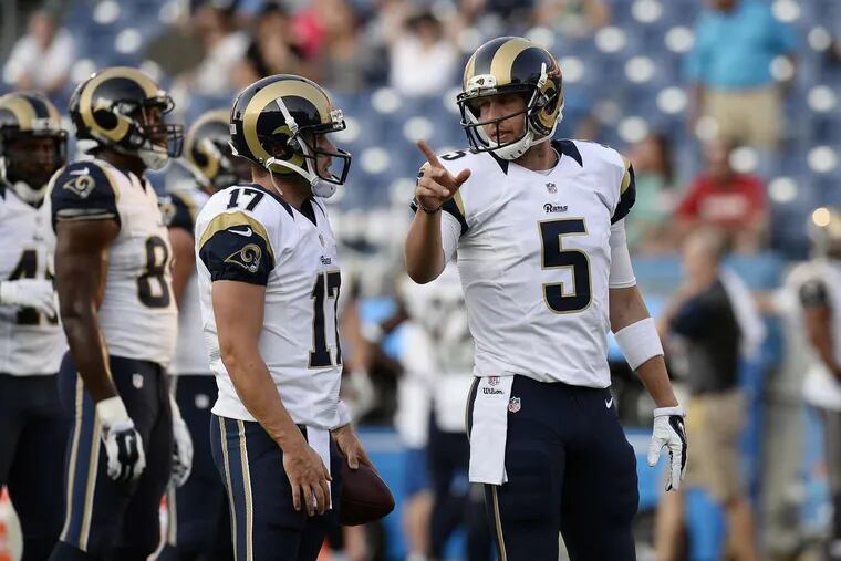 Nick Foles (right) talks to Case Keenum during their shared tenure with the Rams in 2015.