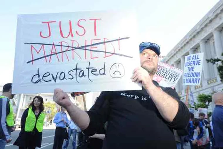 Gary Young, who wed last year, and other backers of same-sex marriage protested Tuesday outside San Francisco City Hall after California's high court upheld a ban on gay marriage.