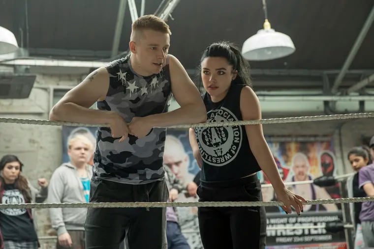 This image released by Metro Goldwyn Mayer Pictures shows Jack Lowden, left, and Florence Pugh in a scene from "Fighting with My Family." (Robert Viglasky/Metro Goldwyn Mayer Pictures via AP)