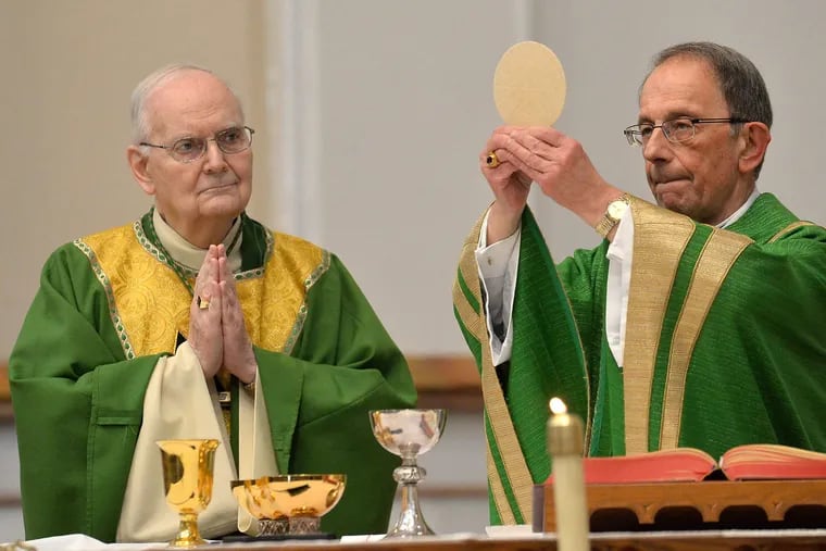 Erie Catholic Bishop Emeritus Donald Trautman, left, and Erie Catholic Bishop Lawrence T. Persico celebrate Communion during Mass at St. Peter Cathedral in Erie on Feb. 11, 2018.