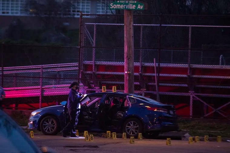 Philadelphia crime scene unit laying down evidence tags after the shooting of a police officer at 15th Street and West Somerville Avenue in North Philadelphia on Wednesday, April 7, 2021.