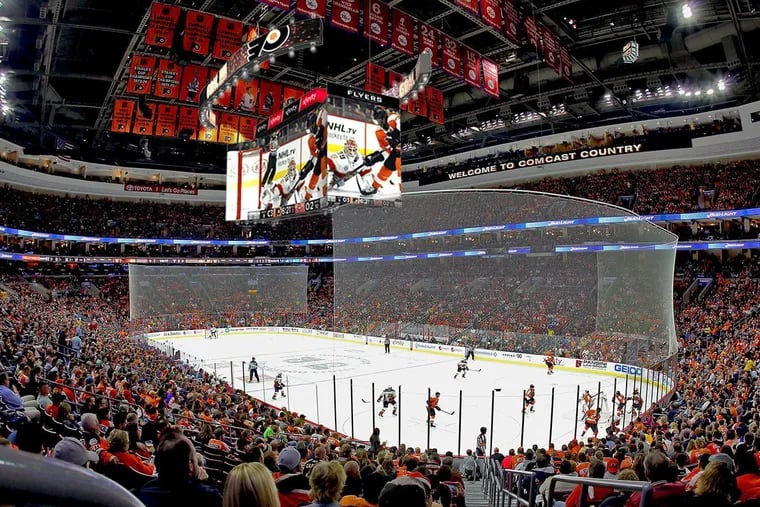 Sports fans and others at the Wells Fargo Center can watch replays and other video on a new huge scoreboard as part of the arena's $250 million renovation.