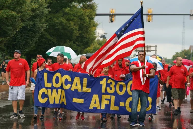 Communications Workers of America Local 13000 march in the Labor Day Parade on South Columbus Boulevard on September 2, 2019.