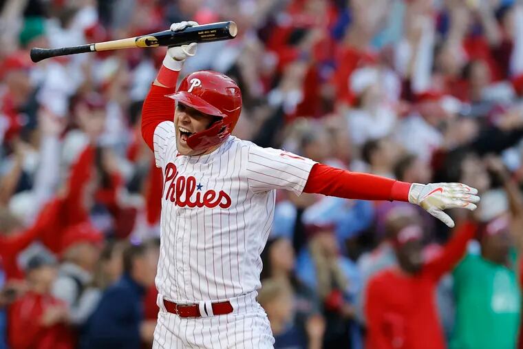 Philadelphia Phillies first baseman Rhys Hoskins throws his bat after is dramatic three-run homer in the 2022 Braves playoff series. On Friday, the winds won't be homer-friendly.