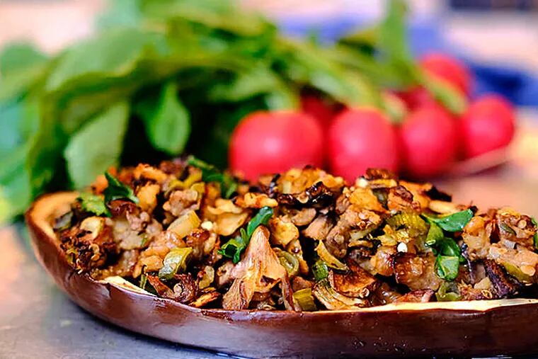 A hearty baked mushroom-stuffed eggplant is a nice side dish for lamb or chicken and offers a flavorful and filling vegetarian option to the menu. ( Ed Hille / Staff Photographer )