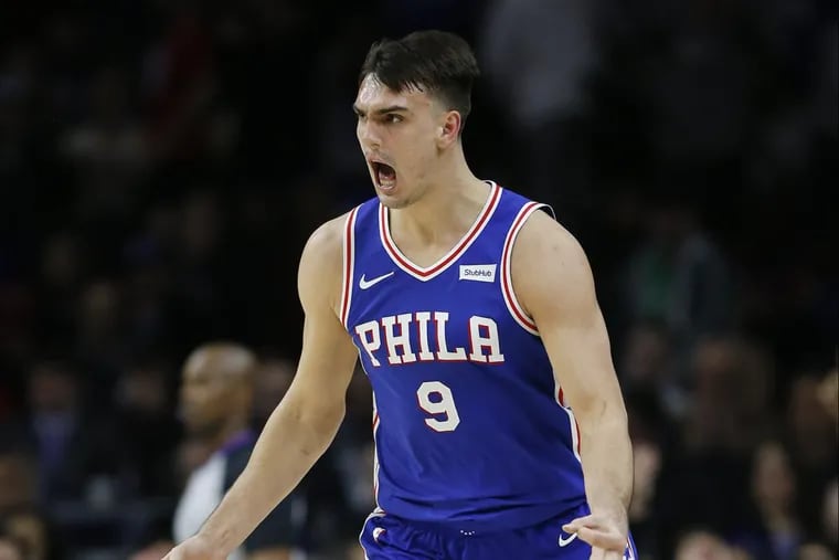 Dario Saric celebrates during the fourth quarter after making a three-pointer against the New York Knicks during the Sixers’ 108-92 win on Monday.