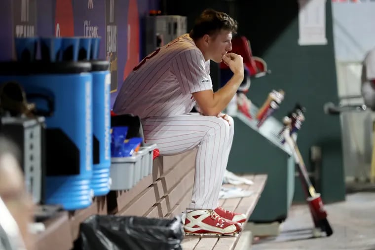 Nick Pivetta of the Phillies sits in the dugout after getting pulled in the 4th inning against the Nationals at Citizens Bank Park on April 10, 2019.