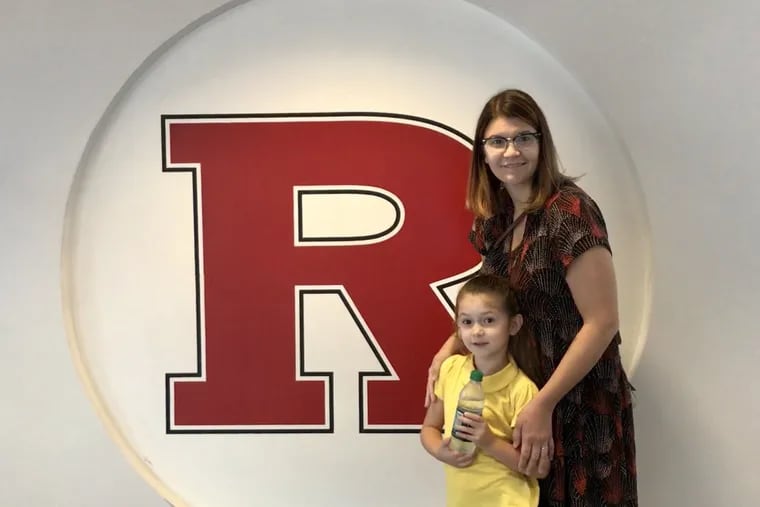 Robin Roscigno, fifth-year doctoral student in the Graduate School of Education, with her daughter, Pia, 8. Roscigno is in danger of losing her funding June 30.