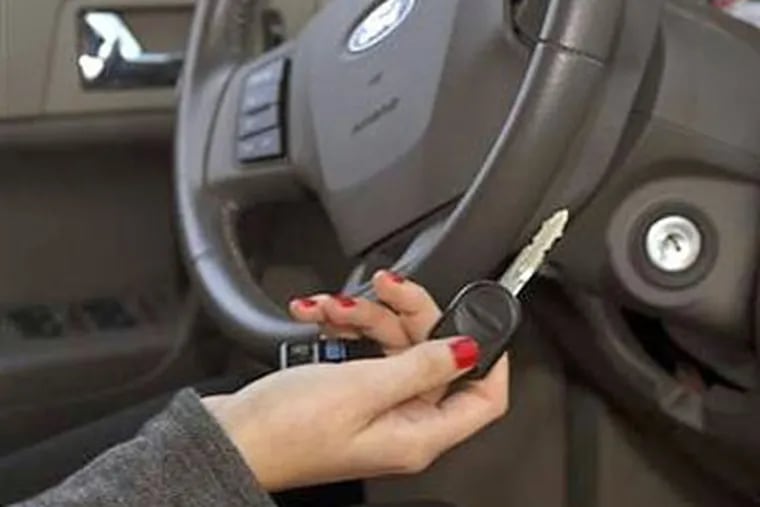 Ford Motor Co. has rolled out a new computerized car key feature, called MyKey, that lets parents limit the car's speed to 80 mph and set a maximum volume for the audio system on some 2010 models. (Ford Motor Co. / AP)