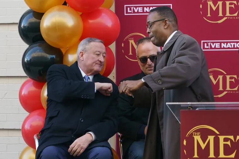 Mayor Kenney (left) and Philadelphia City Council President Darrell Clarke fist bump at the opening of the newly restored Met Philadelphia last week. Both want to reform the city's process for selling vacant lots.