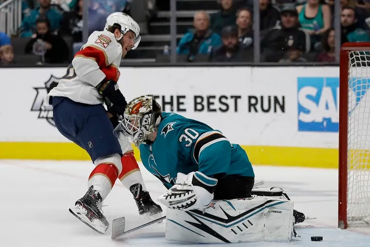 Florida Panthers winger Mike Hoffman scores against San Jose's Aaron Dell last week. Hoffman is reportedly available on the trade market.