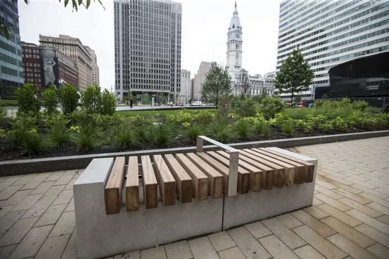 One of the benches on the west side of LOVE Park has a metal armrest, which would make it near impossible to sleep on.