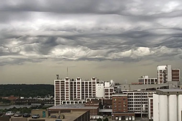 Photo from a downtown Cedar Rapids, Iowa office building shows what may become the first new cloud type to be recognized by scientists since 1956. (AP)