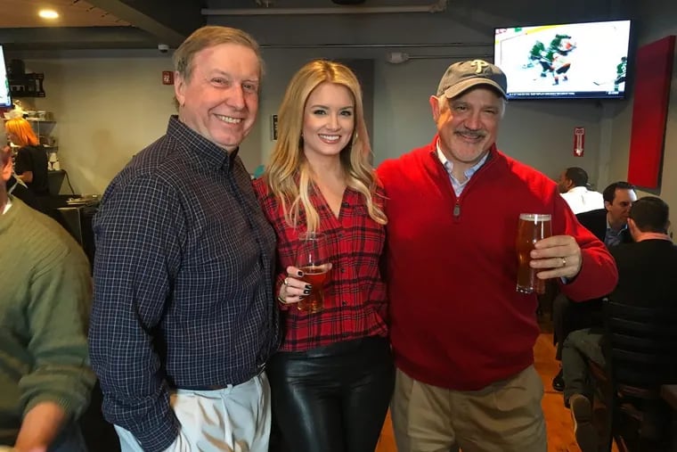 Conshohocken Brewing Co. co-owner Glen Macnow (right) with personalities Ray Didinger and Jillian Mele at a holiday party for the Bridgeport location on Dec. 10, 2016.