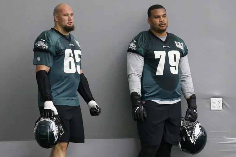 Eagles tackle Lane Johnson (65) with guard Brandon Brooks (79) during practice Tuesday at the NovaCare Complex.