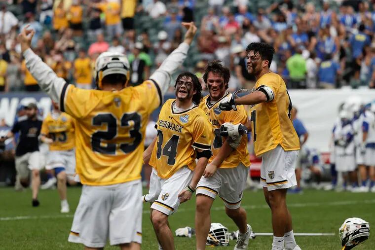 Merrimack players celebrate their NCAA men's lacrosse Division II championship at Lincoln Financial Field.
