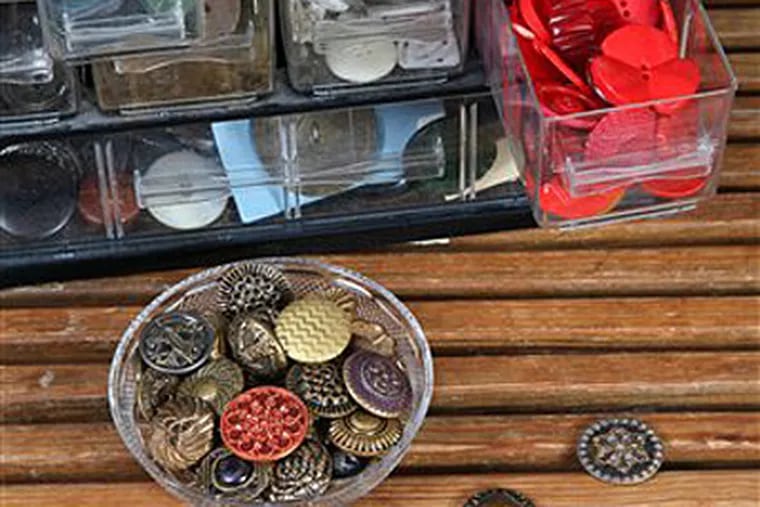 This undated photo shows a portion of Carol Schneider's large vintage buttons collection. Schneider incorporates buttons into the handmade goods she crafts. (AP Photo/Doug Schneider, HO)