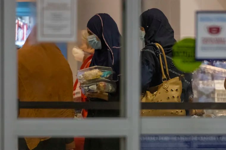 Afghan evacuees began arriving at Philadelphia International Airport in August, here seen passing through Terminal A East. Flights into the city are expected to resume this week after being paused last month by measles cases.