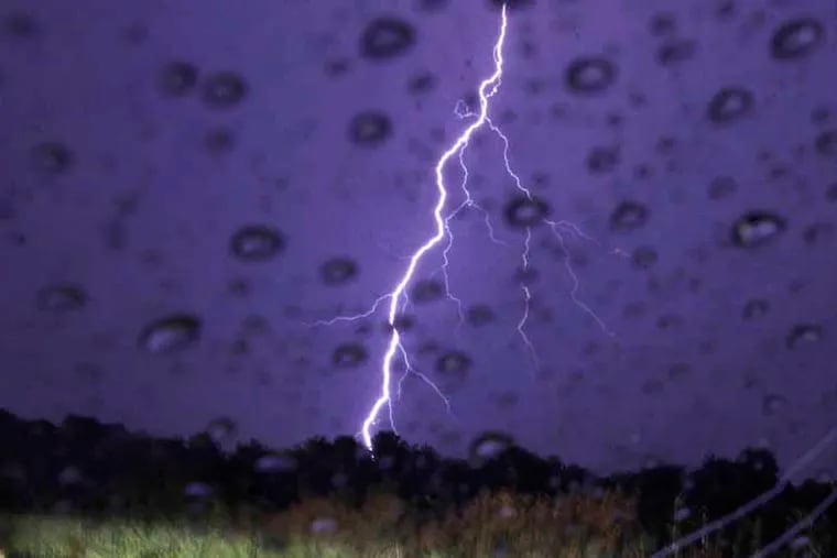 Cloud to ground lightning and lots of rain on Blackwood-Barmsboro Rd (near Gloucester County College) at 12:25 am on June 30, 2012.   ( ELIZABETH ROBERTSON / Staff Photographer )