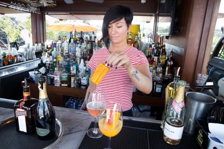 Bartender Samantha Gross makes wine Popsicles at the Moshulu restaurant in Philadelphia.