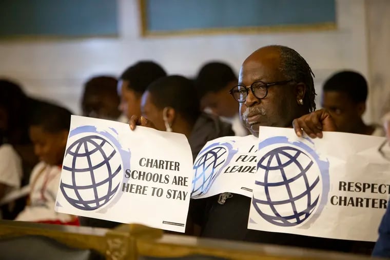 Avery Bessellieu, parent of two children at Global Leadership Academy, protests inside City Council Chambers to deliver a message to the Board of Education on Thursday, May 23, 2019. Some Philadelphia charter school leaders are accusing the Philadelphia School District of targeting black-led charter schools for closure.