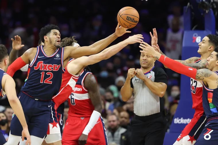 Tobias Harris, left, of the Sixers battles L-R: Corey Kispert, Kyle Kuzma, and Danny Green for the ball during the game against the Wizards at the Wells Fargo Center on Wednesday.