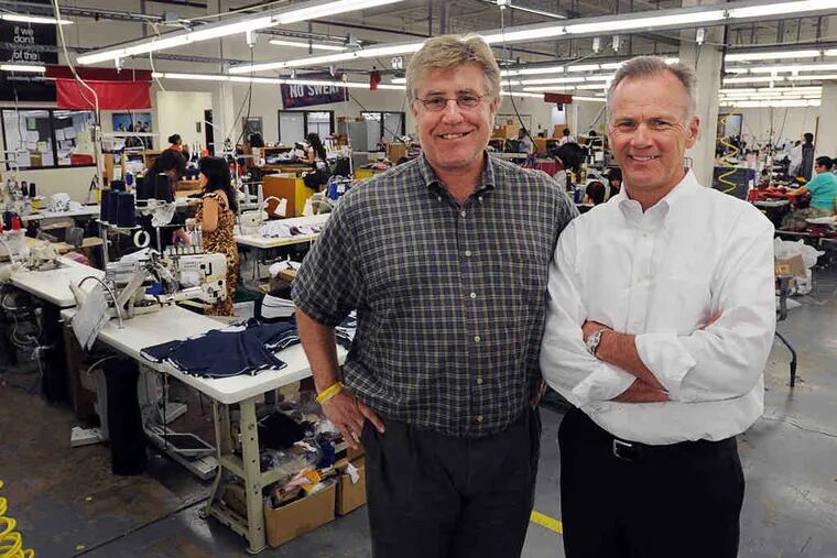 John Strotbeck (left), founder, and Doug Tibbetts, CEO, at Boathouse Sports' Northeast Philly plant. Strotbeck, a former rower, started the business with a design for more comfortable, durable rowing shorts. Today, the company outfits high school and college athletes in sports played at the Olympic level.