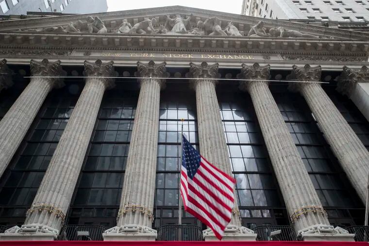 FILE- In this Nov. 20, 2018, file photo an American flag flies outside New York Stock Exchange.