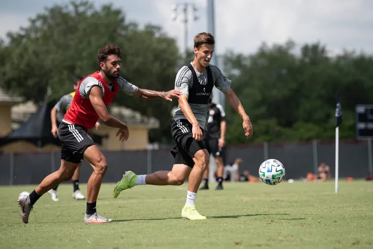 Matej Oravec, right, dribbling the ball away from Matthew Real during a Philadelphia Union practice session during the MLS Is Back Tournament on July 16at Disney World's ESPN Wide World of Sports near Orlando, Fla.