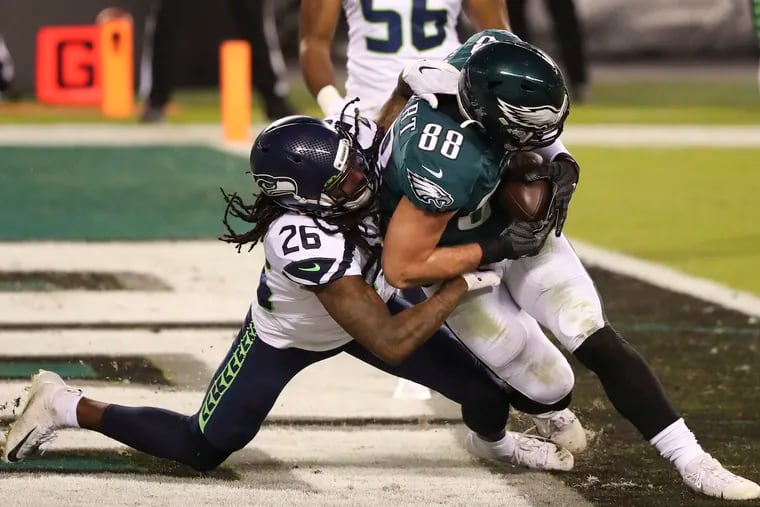 Eagles tight end Dallas Goedert had seven catches Monday night, including this one for a second-quarter touchdown. But he and Carson Wentz weren't on the same page on a critical fourth-and-4 in the fourth quarter.
