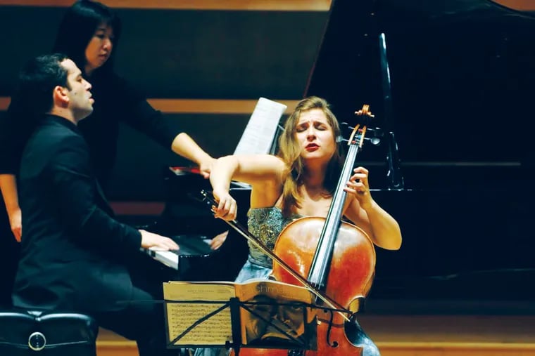 Page-turner Yung-Chen Lin (background left) turns pages for pianist Inon Barnatan in a Philadelphia Chamber Music Society performance with cellist Alisa Weilerstein.
