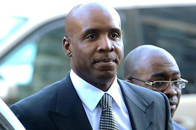 Barry Bonds will remain free while he appeals his conviction for giving misleading testimony before a grand jury. (Noah Berger/AP)