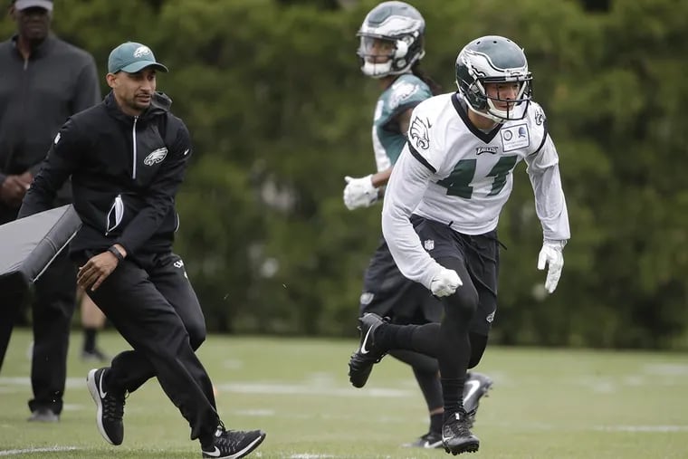 The Eagles’ Mitchell White (41) runs a drill during rookie minicamp in May.