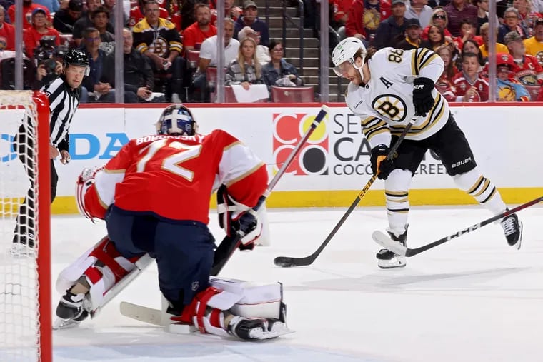 David Pastrnak #88 of the Boston Bruins shoots the puck against Sergei Bobrovsky #72 of the Florida Panthers during the first period in Game Five of the Second Round of the 2024 Stanley Cup Playoffs at Amerant Bank Arena on May 14, 2024 in Sunrise, Florida. (Photo by Joel Auerbach/Getty Images)