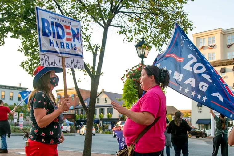 Mothers on opposite sides of the political divide come together for a conversation as supporters of both President Trump and Democratic presidential nominee Joe Biden gather in downtown Gettysburg Oct. 6, 2020 while former Vice President Joe Biden speaks at the nearby battlefields.  (Note only one of the women would give her name, so I did not identify either.)