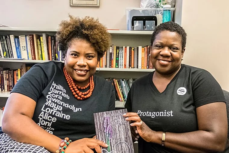 NewSeason Books releases "The Search for Susu" a novel by Marcella McCoy-Deh and T.M. Giggetts that tackles internet shaming. Here,T.M. Giggetts, left and co-writer Marcella McCoy-Deh share a moment with their book at Philadelphia University. ( ED HILLE / Staff Photographer )