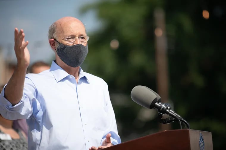 Pennsylvania Gov. Tom Wolf speaking with the press outside of the Broad Street Market on July 9. Wolf needs to lead on climate change the way he has led on fighting the coronavirus, writes Nadia Steinzor.