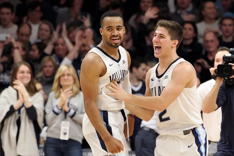 Phil Booth, left, and Collin Gillespie of Villanova celebrate after their victory over St. John’s at Finneran Pavilion on Jan. 8, 2019.