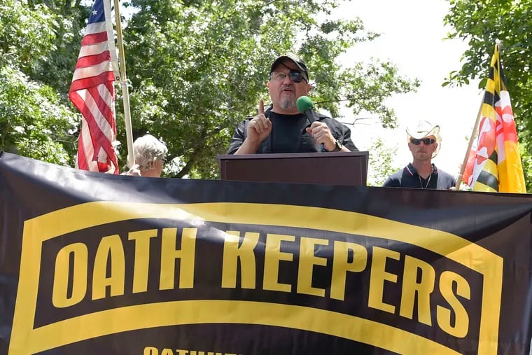 Stewart Rhodes, founder of the Oath Keepers, center, speaks during a rally outside the White House in Washington, D.C. on June 25, 2017.