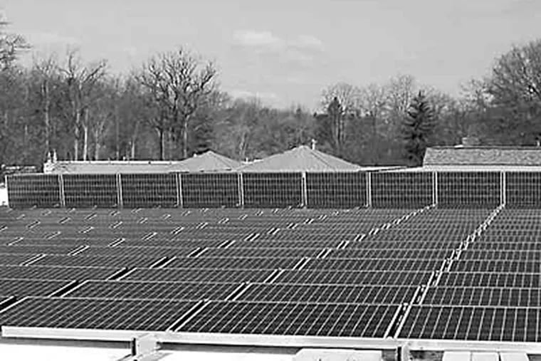 The roof of the Vare Field House at Springside School in Philadelphia is covered with solar panels. Pennsylvania plans policy changes that would ease barriers to such school changes.