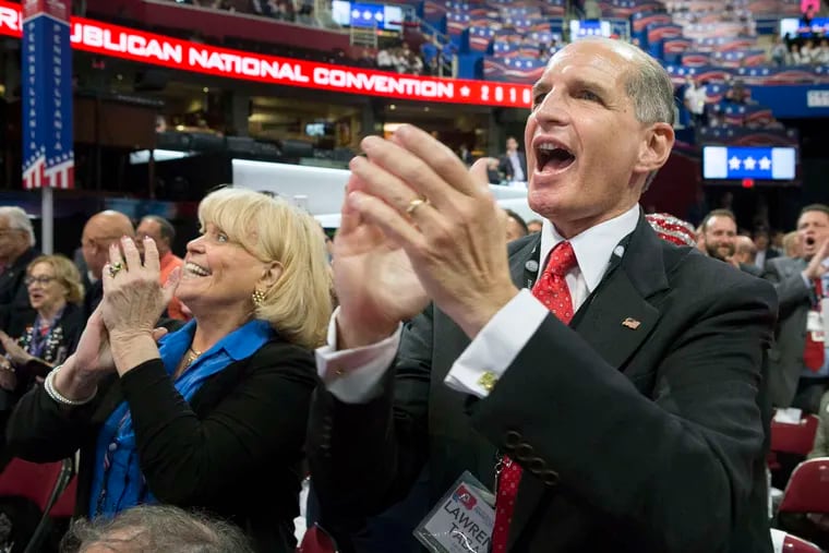 Lawrence Tabas (right) is set to become the next chairman of the Pennsylvania Republican Party if a deal is struck with the acting chairman, Bernadette "Bernie" Comfort. Here Tabas is seen cheering at the 2016 Republican National Convention.