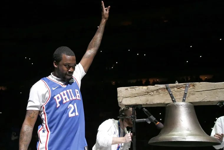 Rapper Meek Mill raises his arm after ringing the Liberty Bell replica before the playoff game between the Sixers and the Heat at the Wells Fargo Center on April 24, 2018. Mill, incarcerated since November, was released on bail.