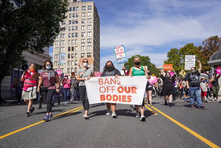 People march around the Pennsylvania State Capitol Building for the Bans Off Our Bodies rally in Harrisburg last week.